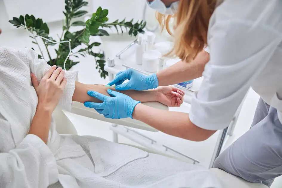 Healthcare professional giving a vitamin shot at a clinic in Westport, CT